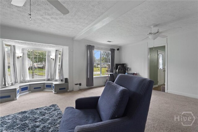 75 Brown Thrasher Ct, Richmond Hill, GA 31324 - carpeted living room featuring a ceiling fan, a desk, a textured ceiling, and crown molding