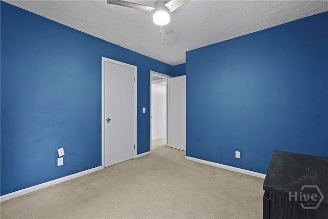 75 Brown Thrasher Ct, Richmond Hill, GA 31324 - unfurnished bedroom featuring carpet flooring, a textured ceiling, and ceiling fan