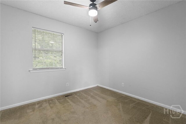75 Brown Thrasher Ct, Richmond Hill, GA 31324 - carpeted spare room featuring a ceiling fan and a textured ceiling