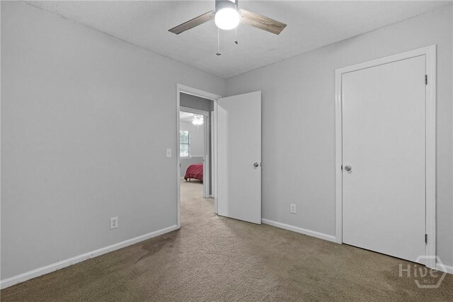75 Brown Thrasher Ct, Richmond Hill, GA 31324 - unfurnished bedroom featuring carpet flooring and a ceiling fan