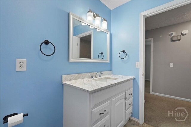 75 Brown Thrasher Ct, Richmond Hill, GA 31324 - bathroom featuring vanity and baseboards