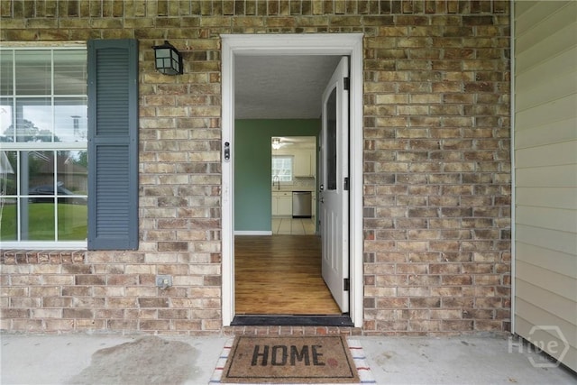 75 Brown Thrasher Ct, Richmond Hill, GA 31324 - doorway to property featuring brick siding