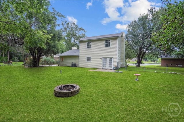 75 Brown Thrasher Ct, Richmond Hill, GA 31324 - back of property with french doors, an outdoor fire pit, and a patio