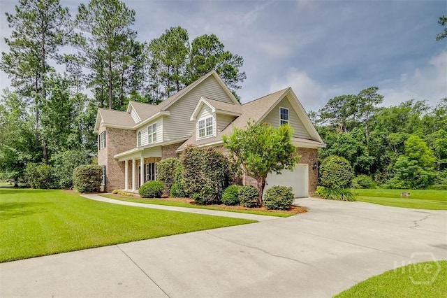 144 Sweetwater Cir, Rincon, GA 31326 - traditional-style house featuring concrete driveway, an attached garage, a front lawn, and brick siding