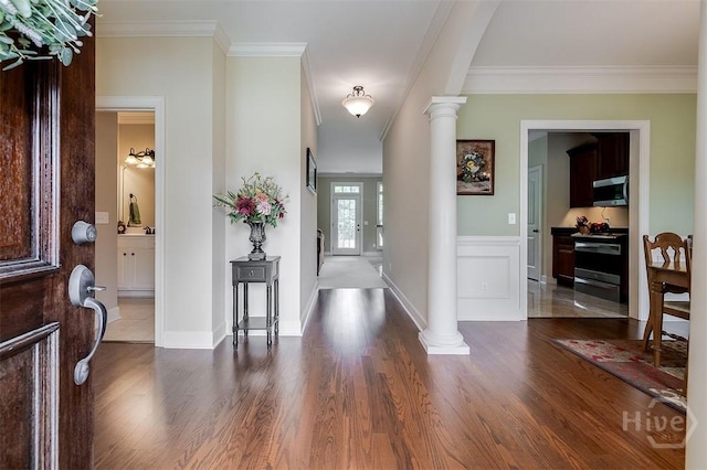 144 Sweetwater Cir, Rincon, GA 31326 - entrance foyer with wood finished floors, decorative columns, and crown molding