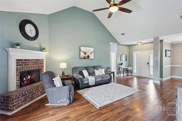 112 Kingsley Dr N, Guyton, GA 31312 - living area featuring a ceiling fan, high vaulted ceiling, a brick fireplace, and wood finished floors