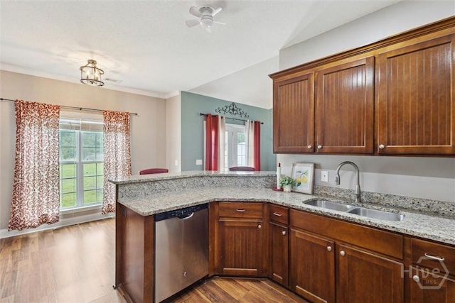 112 Kingsley Dr N, Guyton, GA 31312 - kitchen with stainless steel dishwasher, a peninsula, dark wood-style flooring, light stone countertops, and a ceiling fan