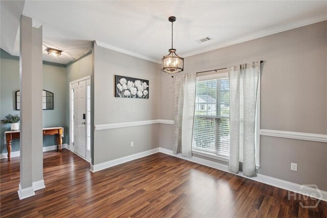 112 Kingsley Dr N, Guyton, GA 31312 - spare room with wood finished floors, a chandelier, and ornamental molding