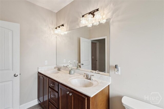 112 Kingsley Dr N, Guyton, GA 31312 - bathroom featuring double vanity and toilet