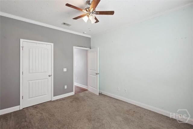 112 Kingsley Dr N, Guyton, GA 31312 - unfurnished bedroom with carpet, crown molding, and ceiling fan