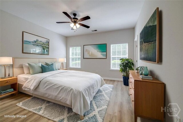 7 Hartland Ct, Savannah, GA 31407 - bedroom with multiple windows, light wood-type flooring, and ceiling fan