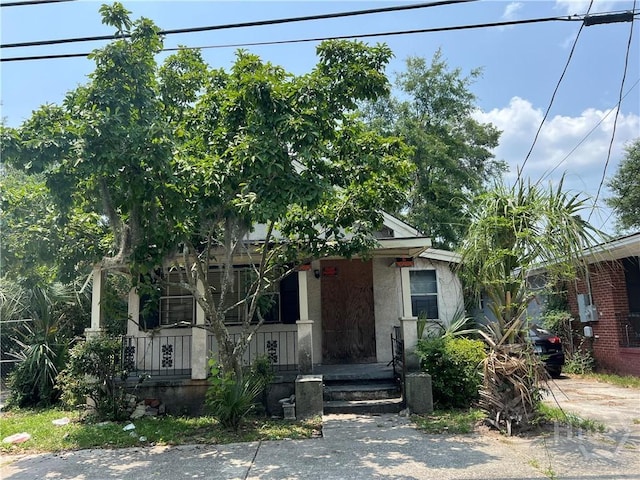 2119 Harden St, Savannah, GA 31415 - view of property hidden behind natural elements featuring covered porch