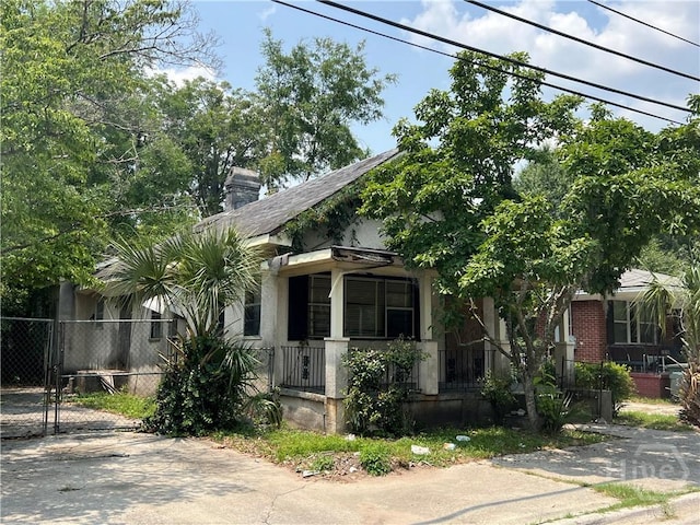 2119 Harden St, Savannah, GA 31415 - view of front of home featuring covered porch, a chimney, and a gate