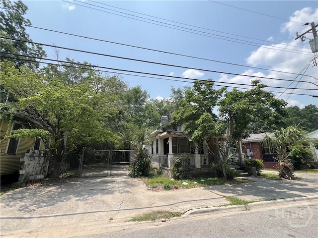 2119 Harden St, Savannah, GA 31415 - view of property hidden behind natural elements with a gate and driveway