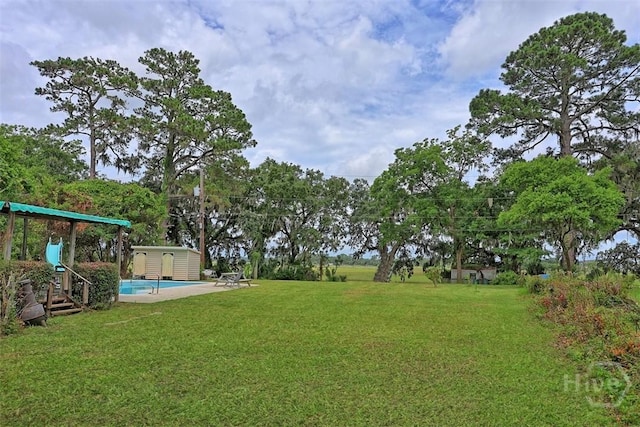 206 Bonaventure Rd, Thunderbolt, GA 31404 - view of grassy yard with a storage unit