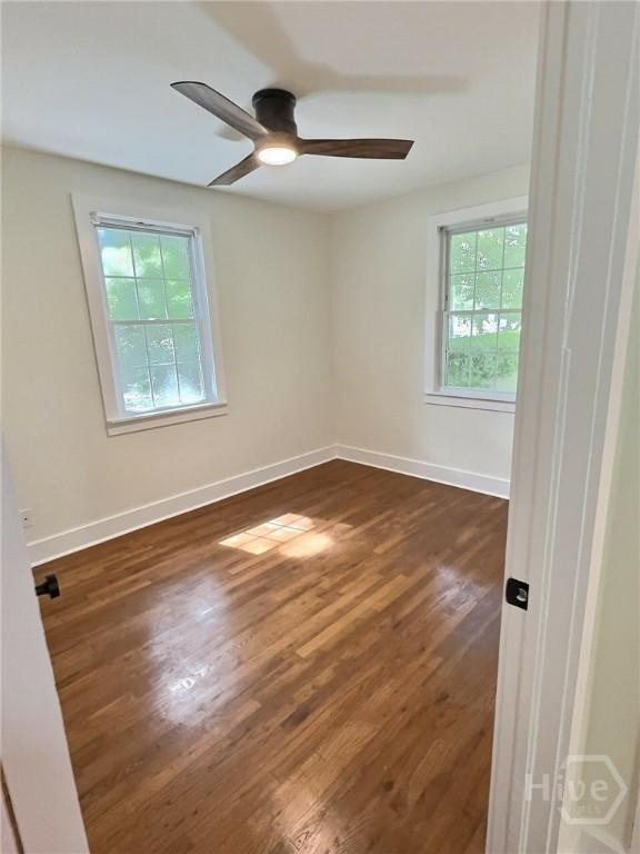 417 E 65th St, Savannah, GA 31405 - empty room featuring dark wood-style floors and ceiling fan