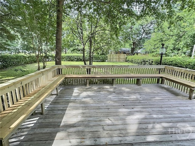 417 E 65th St, Savannah, GA 31405 - deck with a storage shed and view of scattered trees