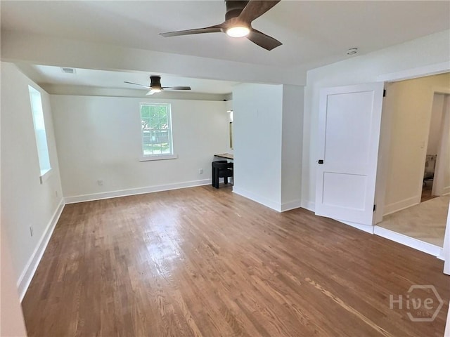 417 E 65th St, Savannah, GA 31405 - unfurnished living room with ceiling fan and wood finished floors