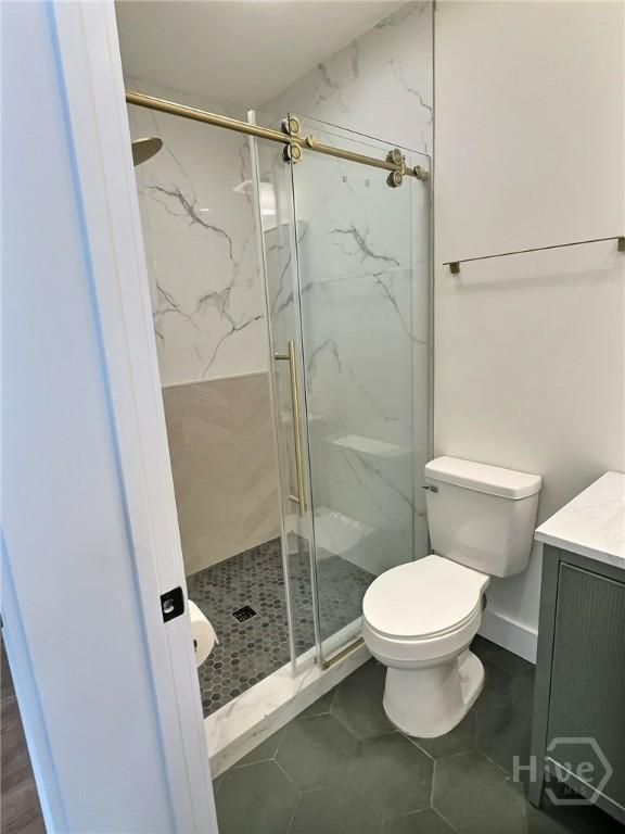 417 E 65th St, Savannah, GA 31405 - full bath featuring vanity, a marble finish shower, and tile patterned floors