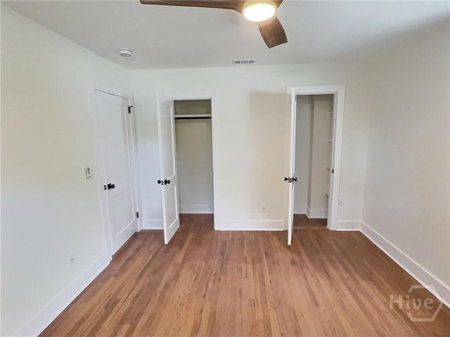 417 E 65th St, Savannah, GA 31405 - unfurnished bedroom with light wood-type flooring, a closet, and a ceiling fan