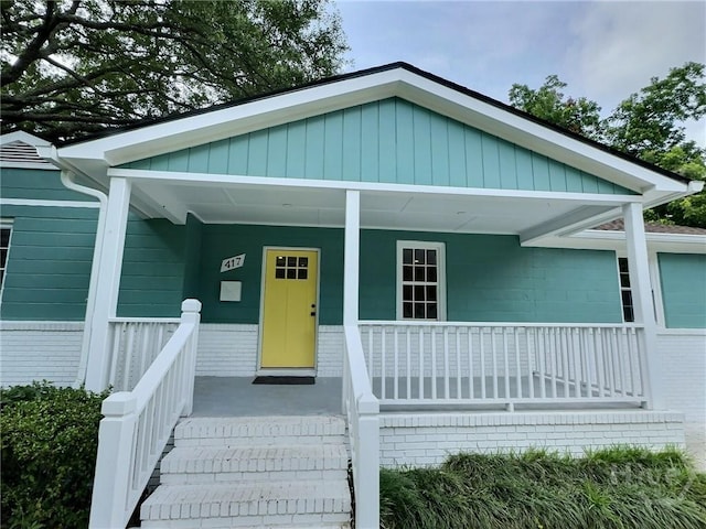 417 E 65th St, Savannah, GA 31405 - view of front of home featuring a porch and brick siding