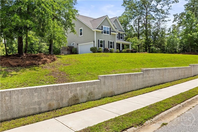 136 Ramsey Way, Rincon, GA 31326 - view of front of house with a garage and a front yard
