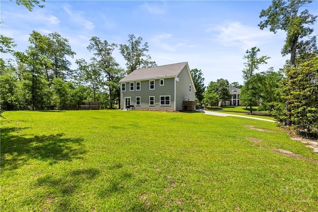 136 Ramsey Way, Rincon, GA 31326 - back of house featuring a yard