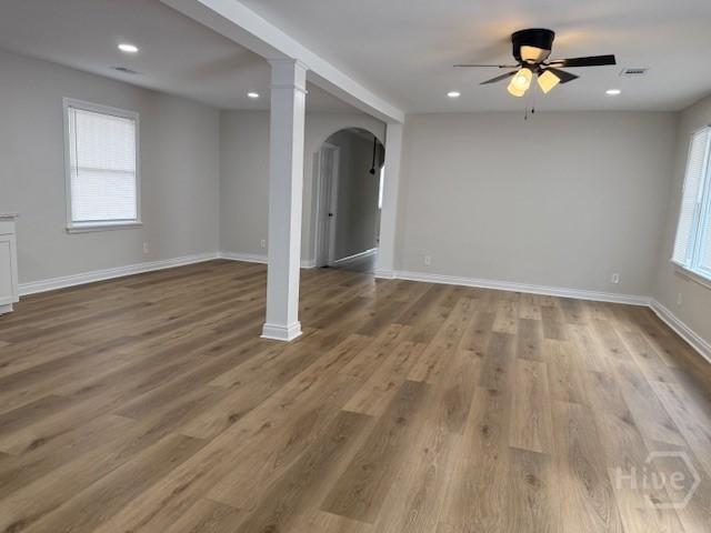 12 Jaguar Ln, Savannah, GA 31419 - unfurnished room featuring a ceiling fan, arched walkways, wood finished floors, recessed lighting, and ornate columns