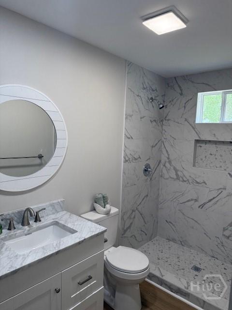 12 Jaguar Ln, Savannah, GA 31419 - bathroom with vanity, a marble finish shower, and wood finished floors