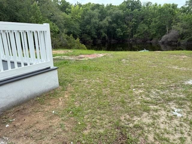 12 Jaguar Ln, Savannah, GA 31419 - view of green lawn featuring a wooded view