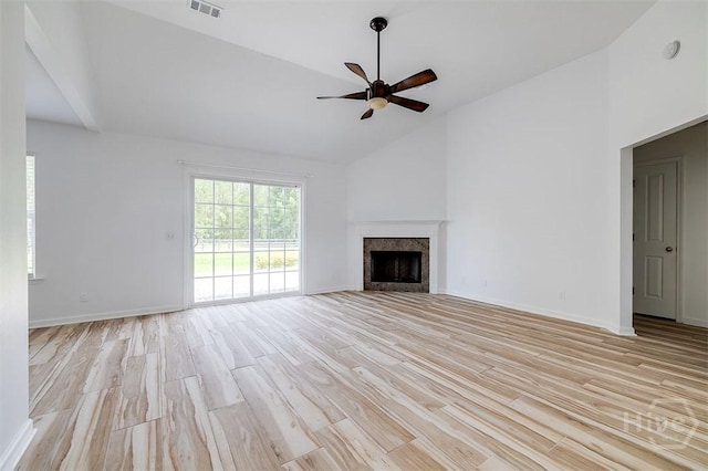 140 Abigail Cir, Ellabell, GA 31308 - unfurnished living room featuring ceiling fan, light wood-style flooring, a fireplace, and high vaulted ceiling