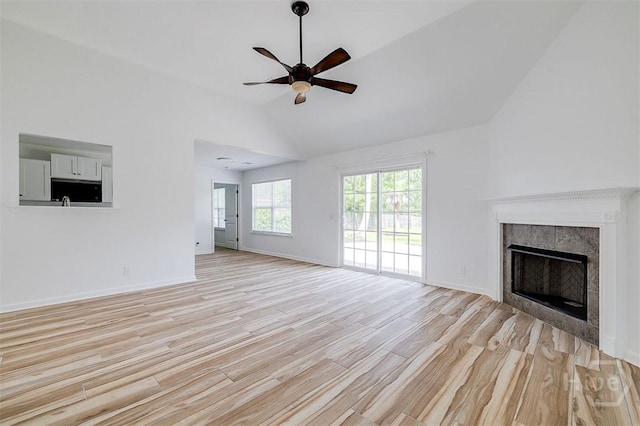 140 Abigail Cir, Ellabell, GA 31308 - unfurnished living room featuring a ceiling fan, light wood finished floors, lofted ceiling, and a fireplace