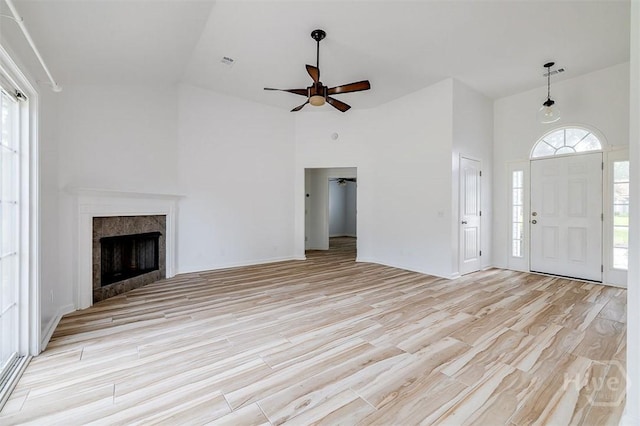 140 Abigail Cir, Ellabell, GA 31308 - unfurnished living room featuring high vaulted ceiling, light wood-type flooring, ceiling fan, and a fireplace