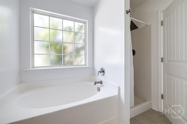 140 Abigail Cir, Ellabell, GA 31308 - full bath featuring a stall shower, a bath, and tile patterned floors