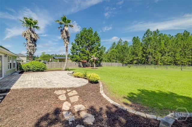 140 Abigail Cir, Ellabell, GA 31308 - fenced backyard with a patio