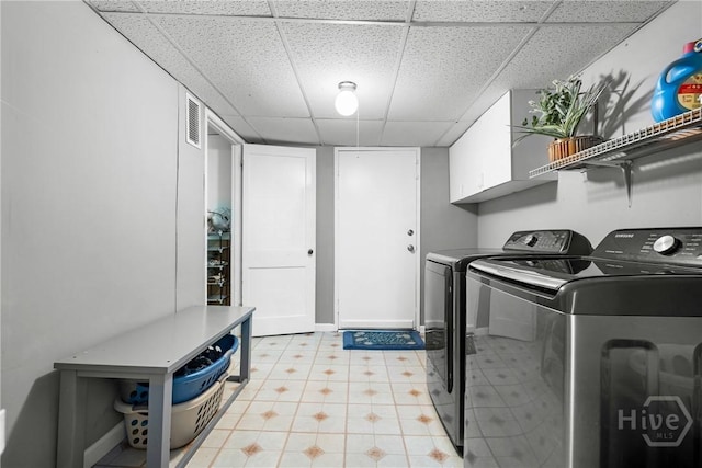 1072 Burtons Ferry Highway, Sylvania, GA 30467 - laundry room featuring washer and dryer, cabinet space, and light floors