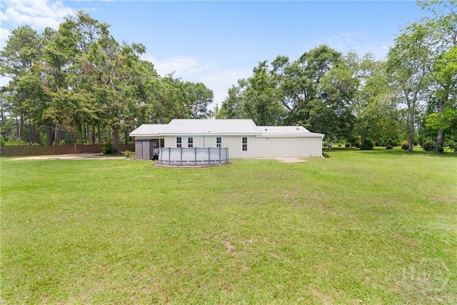 1072 Burtons Ferry Highway, Sylvania, GA 30467 - rear view of house featuring an outdoor pool and view of wooded area