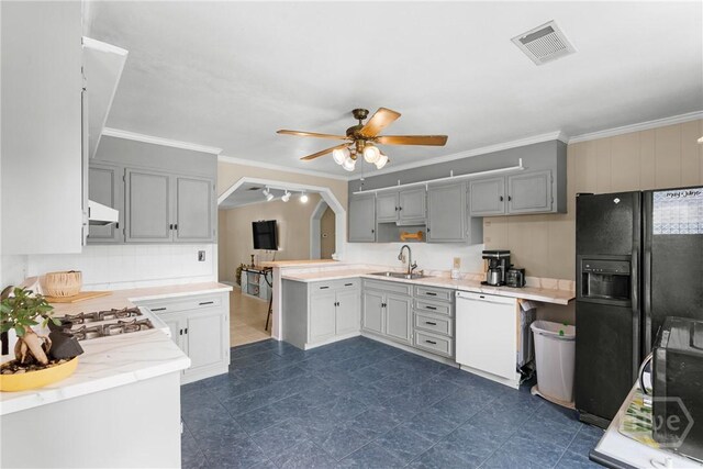 1072 Burtons Ferry Highway, Sylvania, GA 30467 - kitchen featuring dishwasher, black refrigerator with ice dispenser, a ceiling fan, ornamental molding, and a peninsula