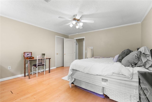 1072 Burtons Ferry Highway, Sylvania, GA 30467 - bedroom with light wood finished floors, crown molding, a textured ceiling, and ceiling fan