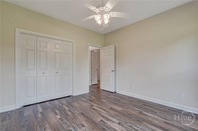 600 Old Louisville Rd, Guyton, GA 31312 - unfurnished bedroom with dark wood-type flooring, a closet, and a ceiling fan