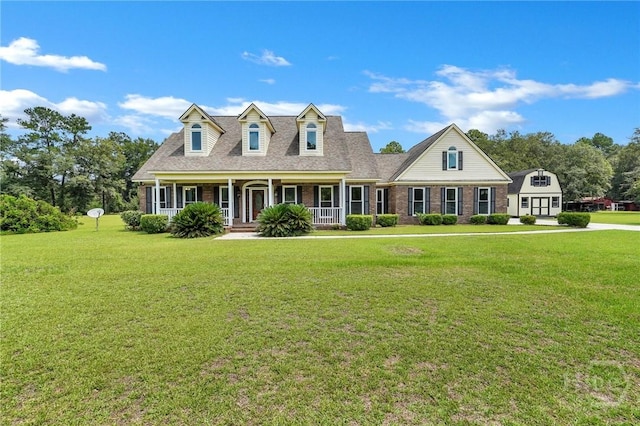 600 Old Louisville Rd, Guyton, GA 31312 - new england style home featuring a porch, a front yard, brick siding, and a shingled roof