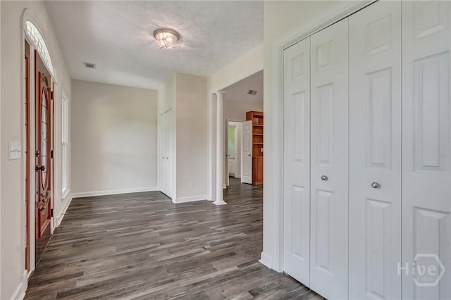 600 Old Louisville Rd, Guyton, GA 31312 - hallway featuring dark wood-type flooring and ornate columns