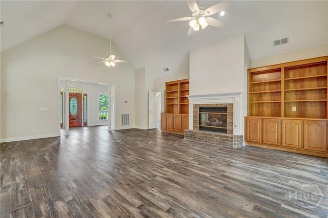 600 Old Louisville Rd, Guyton, GA 31312 - unfurnished living room featuring ceiling fan, dark wood-style floors, a fireplace, and high vaulted ceiling