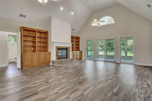 600 Old Louisville Rd, Guyton, GA 31312 - unfurnished living room with ceiling fan, high vaulted ceiling, a fireplace, and wood finished floors