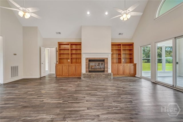 600 Old Louisville Rd, Guyton, GA 31312 - unfurnished living room with high vaulted ceiling, a ceiling fan, dark wood finished floors, a brick fireplace, and recessed lighting