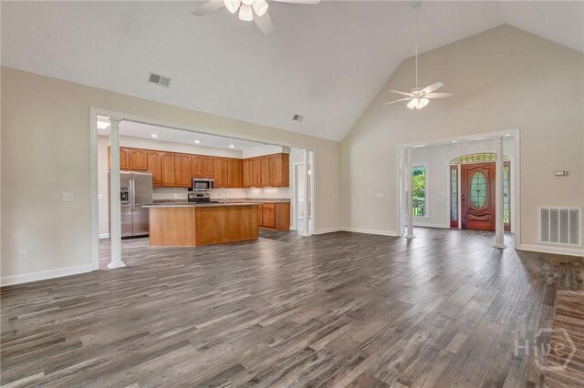 600 Old Louisville Rd, Guyton, GA 31312 - unfurnished living room featuring ceiling fan, high vaulted ceiling, dark wood finished floors, ornate columns, and recessed lighting