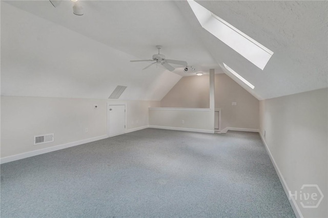 600 Old Louisville Rd, Guyton, GA 31312 - bonus room with vaulted ceiling, a skylight, carpet, and ceiling fan