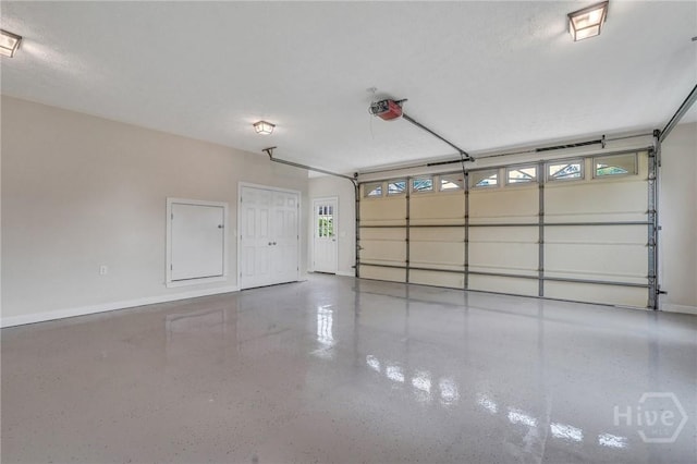 600 Old Louisville Rd, Guyton, GA 31312 - garage featuring a garage door opener and baseboards