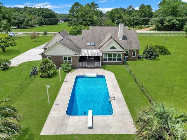 600 Old Louisville Rd, Guyton, GA 31312 - outdoor pool featuring a fenced backyard, a diving board, a patio, and view of wooded area