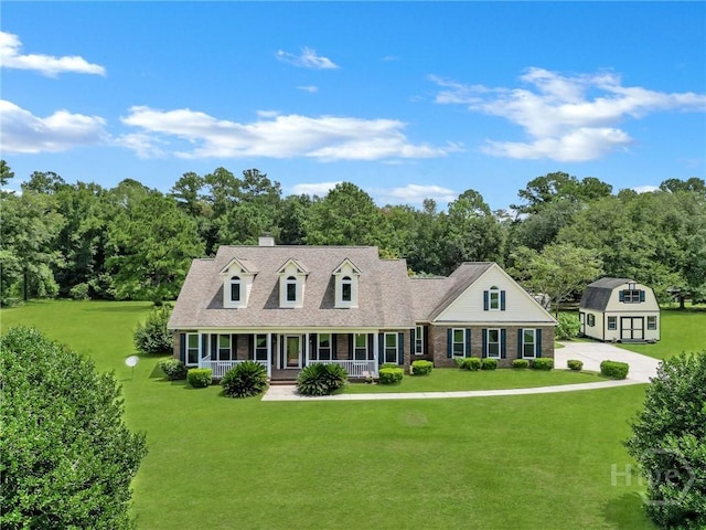 600 Old Louisville Rd, Guyton, GA 31312 - cape cod-style house featuring a porch, a front lawn, and a chimney